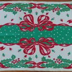 Gold Bells with jadiete holly and red ribbon